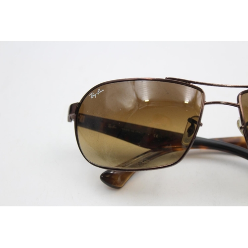 218 - A pair of cased classic Ray-Ban brown oversized rectangular gents sunglasses