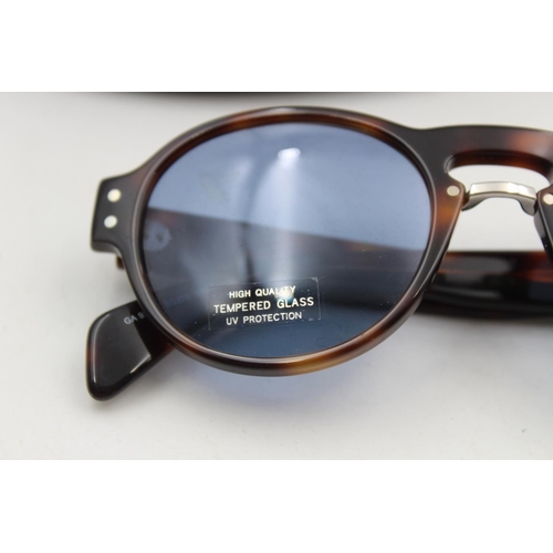 225 - A pair of cased classic Giorgio Armani tortoiseshell effect gents sunglasses