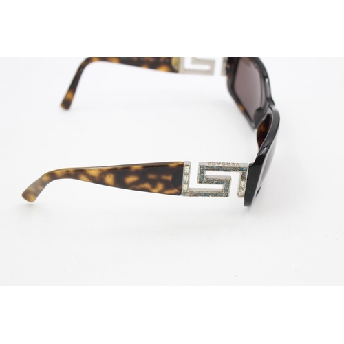 228 - A pair of cased Versace tortoiseshell rectangular framed ladies sunglasses