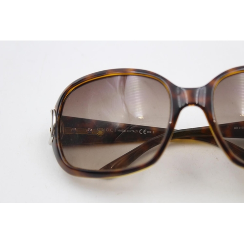 231 - A pair of Gucci brown framed oversize ladies sunglasses with original case