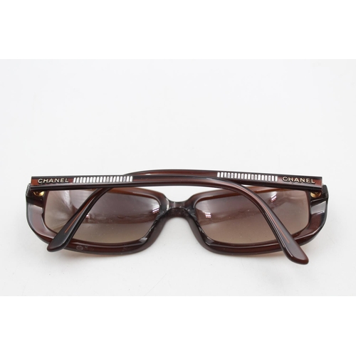 232 - A pair of Chanel brown framed rectangular statement ladies sunglasses