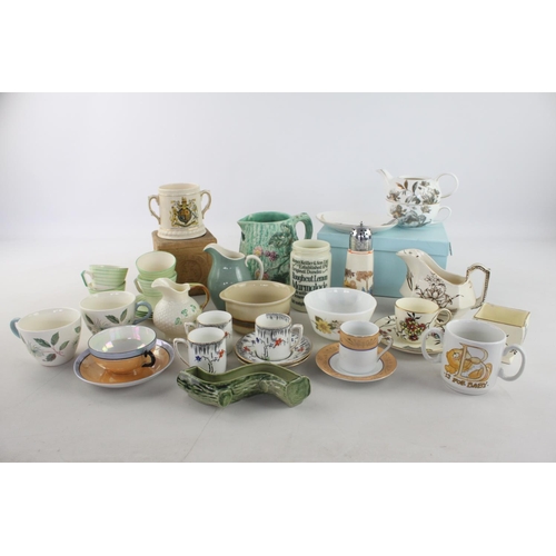 256 - A large collection of assorted china to include Belleek jug, Royal Doulton jug, Wade trinket dish et... 