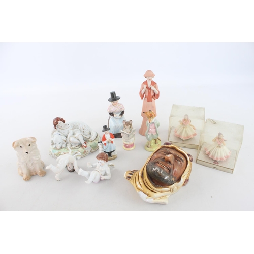 258 - A collection of assorted vintage ceramic figurines