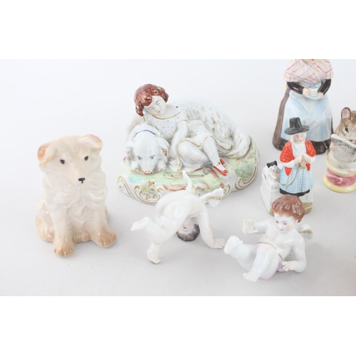 258 - A collection of assorted vintage ceramic figurines