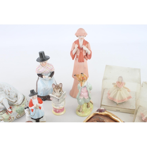 258 - A collection of assorted vintage ceramic figurines