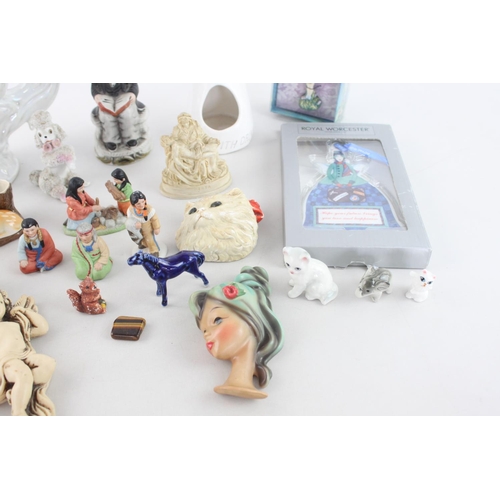 259 - A collection of ceramic figurines to include boxed Royal Worcester Guardian Angel, mid 20th century ... 