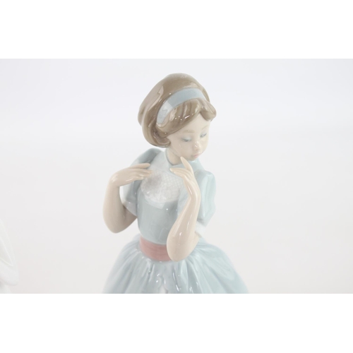 260 - Three assorted ceramic figurines, Lladro 'Proper Pose' no. 6755, Royal Doulton 'Images God Bless You... 