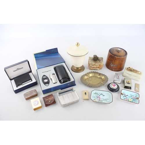 261 - A collection of assorted smoking accessories to include brass ashtray, oak 'baccy' box, Ronson onyx ... 