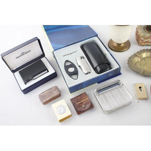 261 - A collection of assorted smoking accessories to include brass ashtray, oak 'baccy' box, Ronson onyx ... 