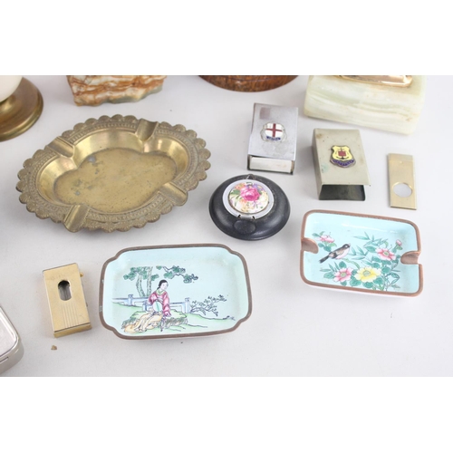 261 - A collection of assorted smoking accessories to include brass ashtray, oak 'baccy' box, Ronson onyx ... 