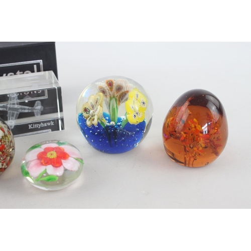 265 - A collection of eight assorted art glass paperweights