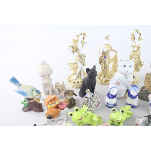 266 - A large collection of assorted ceramic figurines