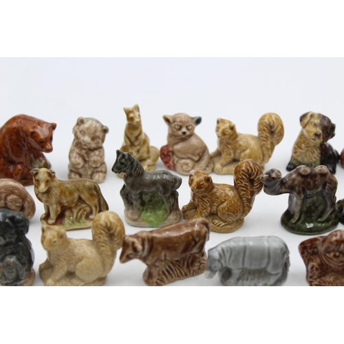 269 - A large collection of Wade Whimsies animal figurines