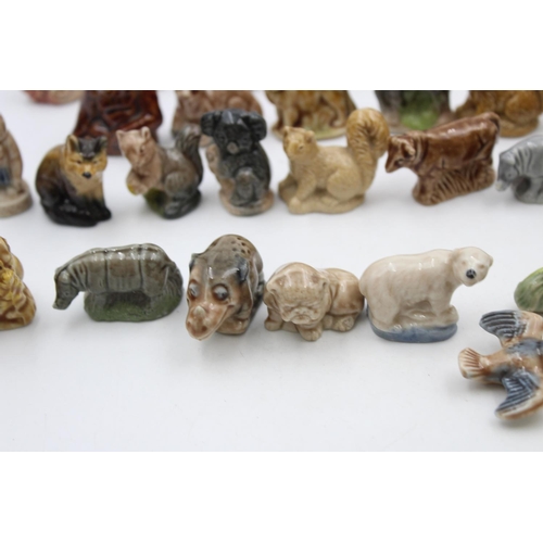 269 - A large collection of Wade Whimsies animal figurines