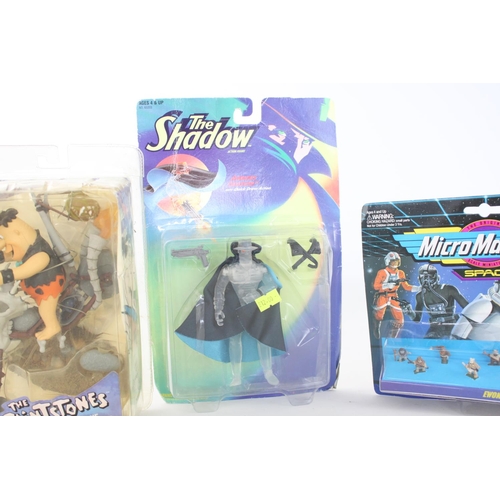 312 - Four carded action figurines to include Flintstones, two Star Wars Micro Machine and Kenner