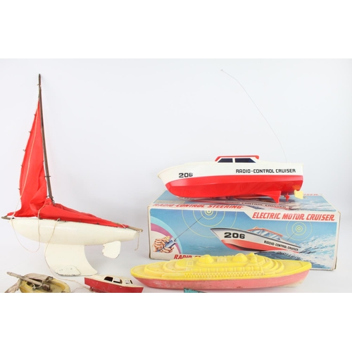 322 - Eight assorted vintage toy boats to include sail, radio controlled Electric Motor Cruiser, penguin e... 