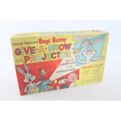 323 - A vintage Chad Valley Bugs Bunny Give A Show projector in original box with slides