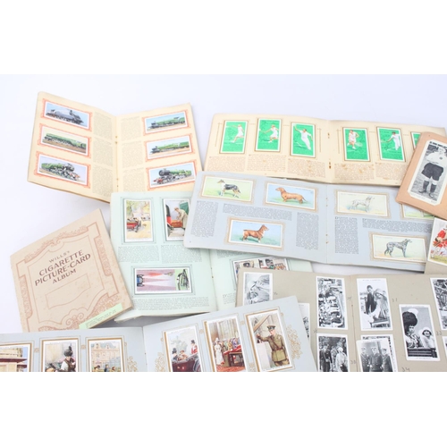 333 - A collection of fifteen assorted cigarette card albums to include Wills's, John Player & Sons Milita... 