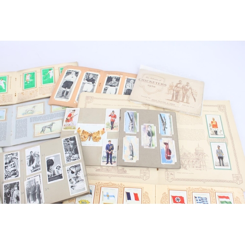 333 - A collection of fifteen assorted cigarette card albums to include Wills's, John Player & Sons Milita... 