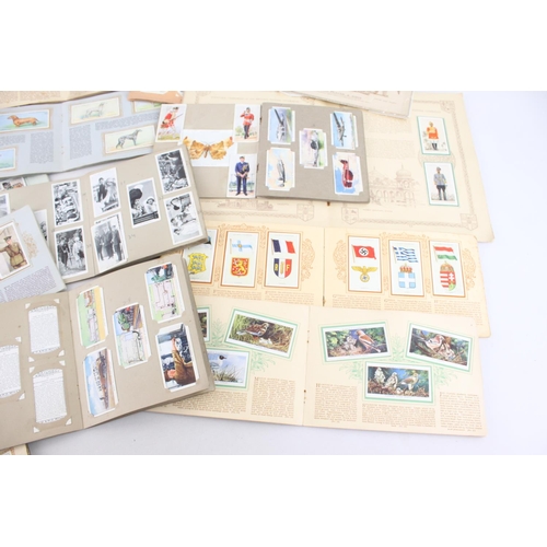 333 - A collection of fifteen assorted cigarette card albums to include Wills's, John Player & Sons Milita... 