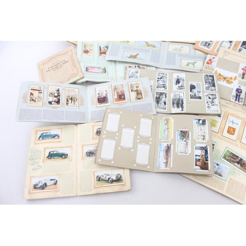 333 - A collection of fifteen assorted cigarette card albums to include Wills's, John Player & Sons Milita... 