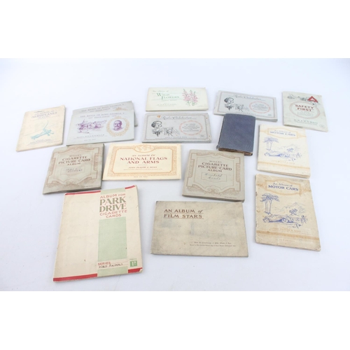 334 - A collection of fifteen assorted cigarette card albums to include W. D. & H. O. Wills Radio Celebrit... 