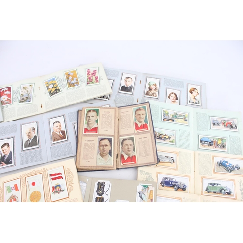 334 - A collection of fifteen assorted cigarette card albums to include W. D. & H. O. Wills Radio Celebrit... 