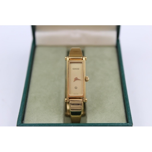 75 - A Gucci 1500 gold tone quartz ladies wristwatch with original box