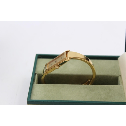 75 - A Gucci 1500 gold tone quartz ladies wristwatch with original box