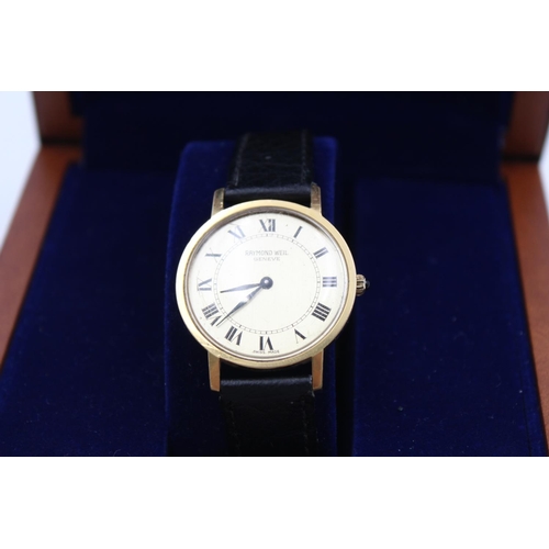 88 - A vintage Raymond Weil gold tone hand wind gents wristwatch with hallmarked .925 silver lidded teak ... 