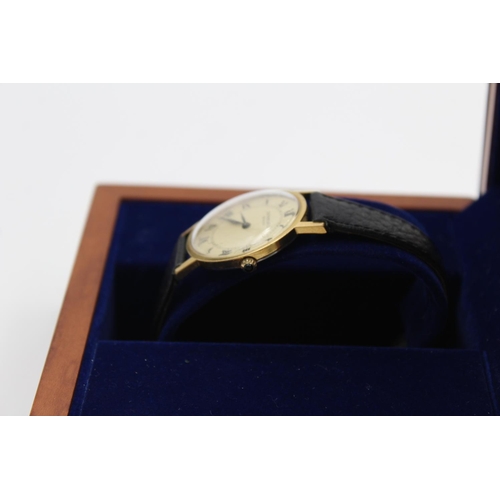 88 - A vintage Raymond Weil gold tone hand wind gents wristwatch with hallmarked .925 silver lidded teak ... 