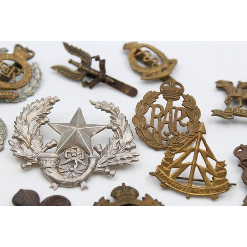 97 - Fifteen assorted vintage military cap badges to include Scottish, S.A.S, Royal West Kent etc.