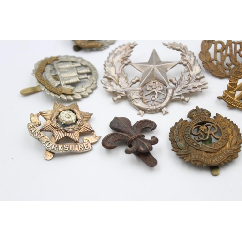 97 - Fifteen assorted vintage military cap badges to include Scottish, S.A.S, Royal West Kent etc.