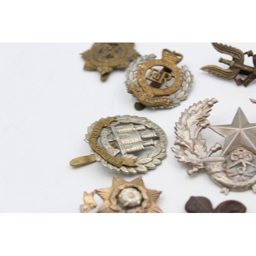 97 - Fifteen assorted vintage military cap badges to include Scottish, S.A.S, Royal West Kent etc.