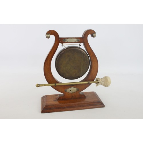 356 - An early 20th century lyre oak and brass ceremonial dinner gong with striker - approx. 30cm high