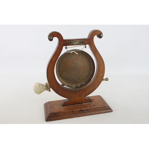 356 - An early 20th century lyre oak and brass ceremonial dinner gong with striker - approx. 30cm high