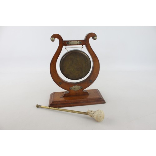 356 - An early 20th century lyre oak and brass ceremonial dinner gong with striker - approx. 30cm high