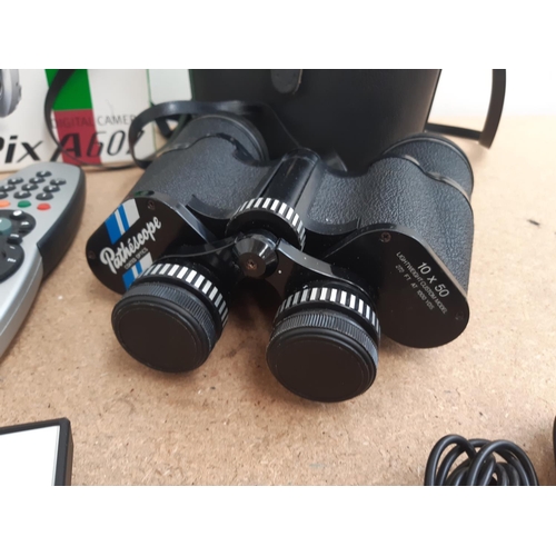 1105 - A box containing cased Pathéscope 10 x 50 binoculars, boxed and cased Fujiflm FinePix A607 digital c... 