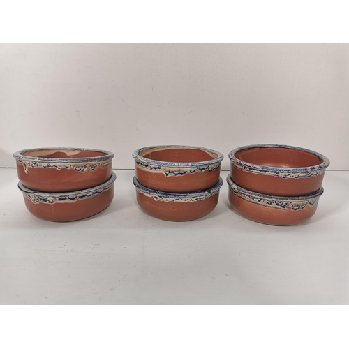 274A - Eight various drip glazed terracotta bowls, six 14.5cm, one 13cm twin handled and one 34cm dairy