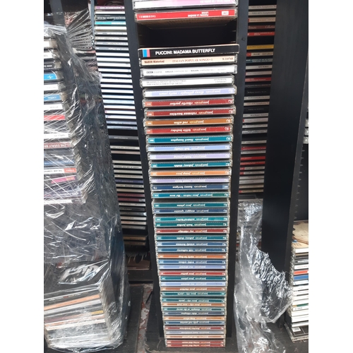 1129 - A large number of CD racks containing mostly classical and jazz CDs