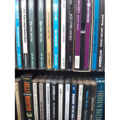 1129 - A large number of CD racks containing mostly classical and jazz CDs