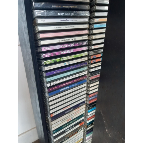 1129 - A large number of CD racks containing mostly classical and jazz CDs