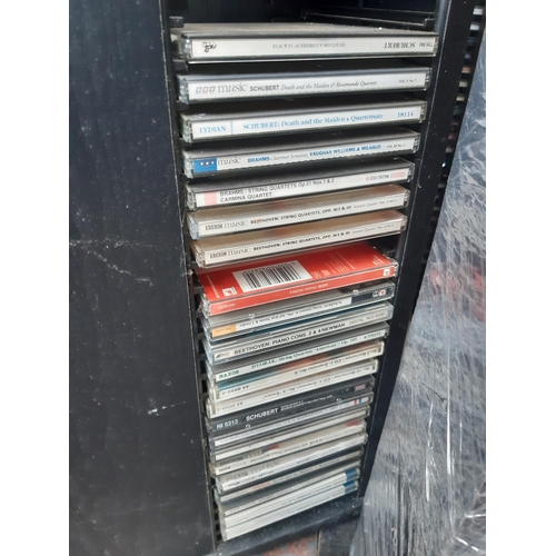 1129 - A large number of CD racks containing mostly classical and jazz CDs