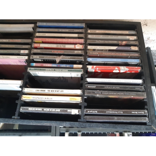 1134 - Two boxes containing a large quantity of CDs to include  Hawkwind, Radiohead, Blondie, The Clash, Pi... 