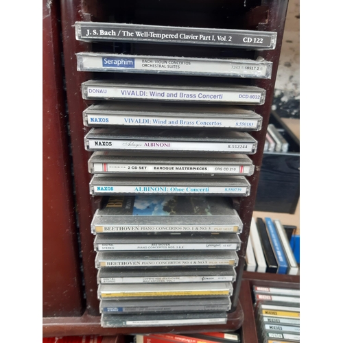 1135 - Six CD racks containing a collection of CDs to include Vivaldi, Albnoni, Beethoven, George Formby, A... 