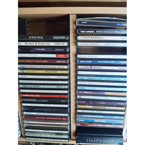 1137 - Five CD racks and a box containg a collection of CDs to include Benny Goodman 10 disc box set, blues... 