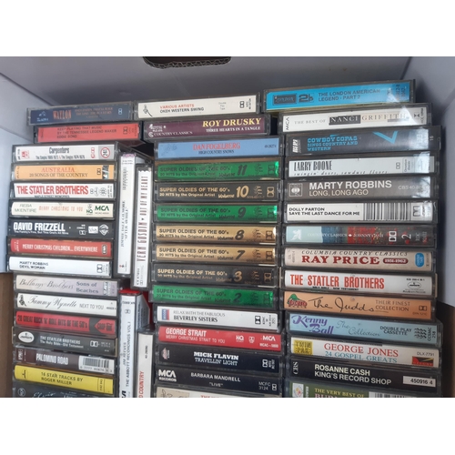 1140 - A box containing a collection of cassette tapes to include The Beatles Box vol. 1-8, Fabulous Fiftie... 