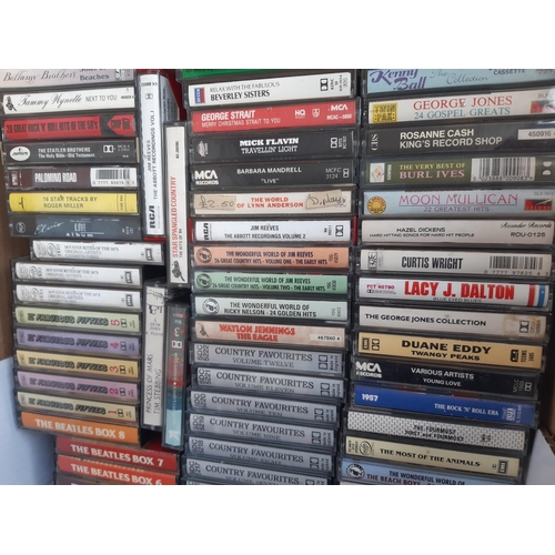 1140 - A box containing a collection of cassette tapes to include The Beatles Box vol. 1-8, Fabulous Fiftie... 