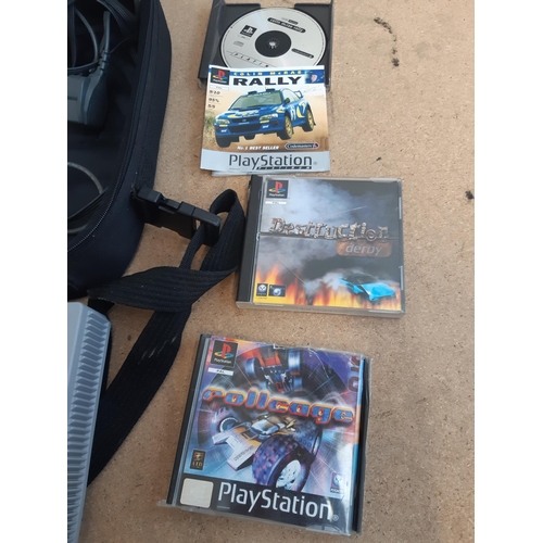 1145 - A cased Sony PlayStation SCPH-7502 with controller, power cable, RFU adaptor and seven games to incl... 