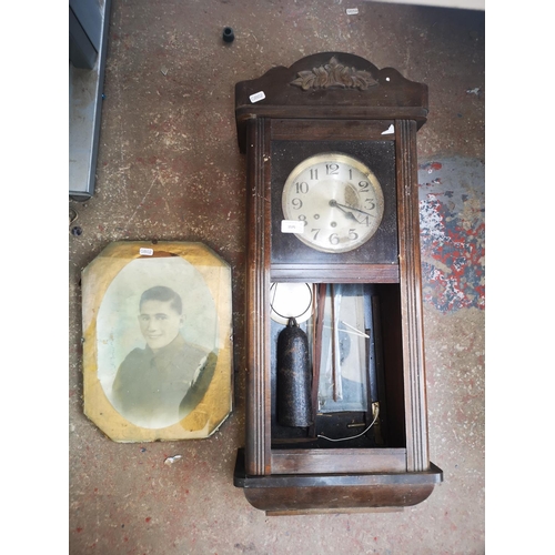 1434 - Two items, one vintage wood cased wall clock and one WWII army infantry picture